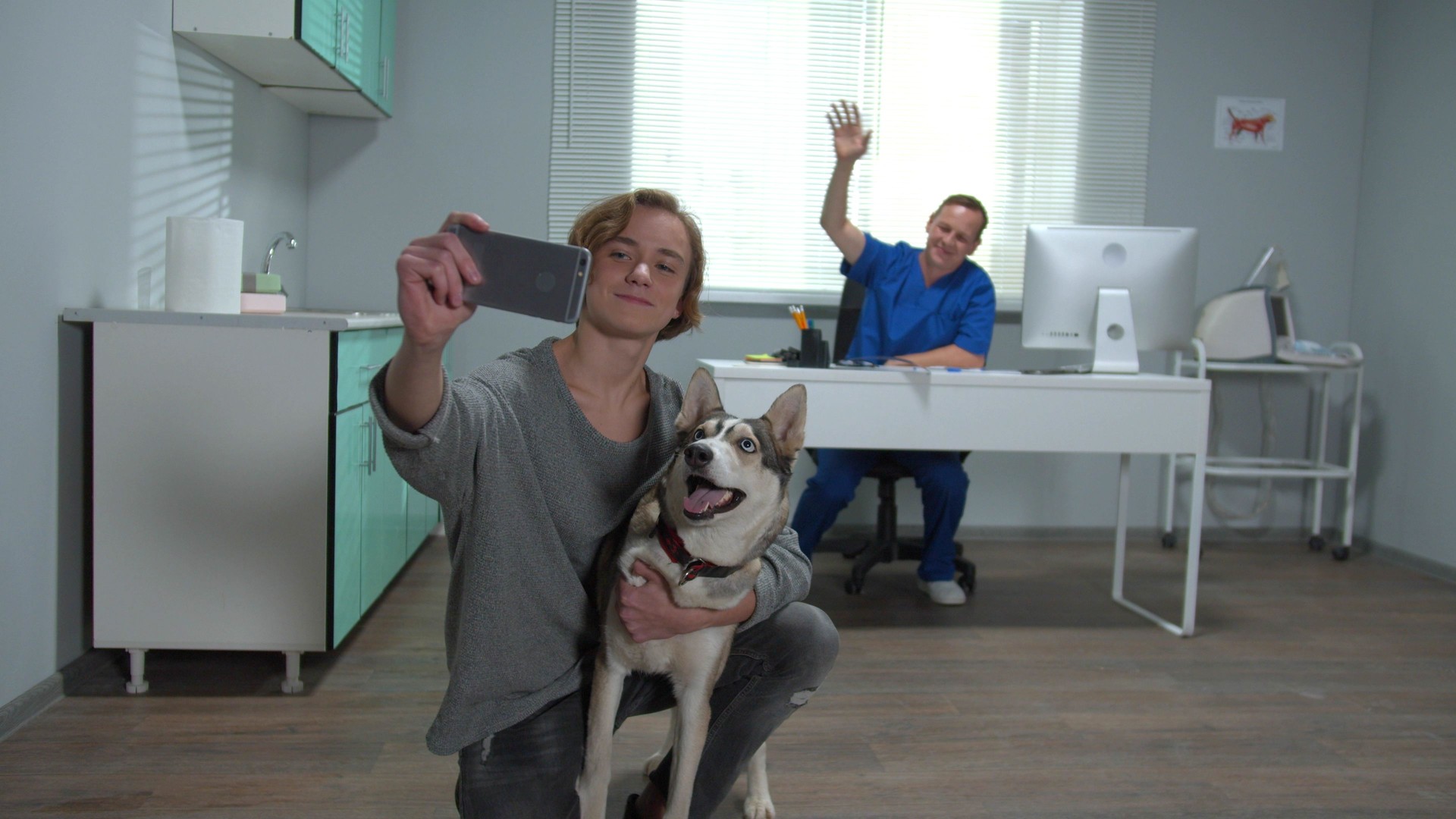 Slow motion, man with husky makes a selfie with vet and dog